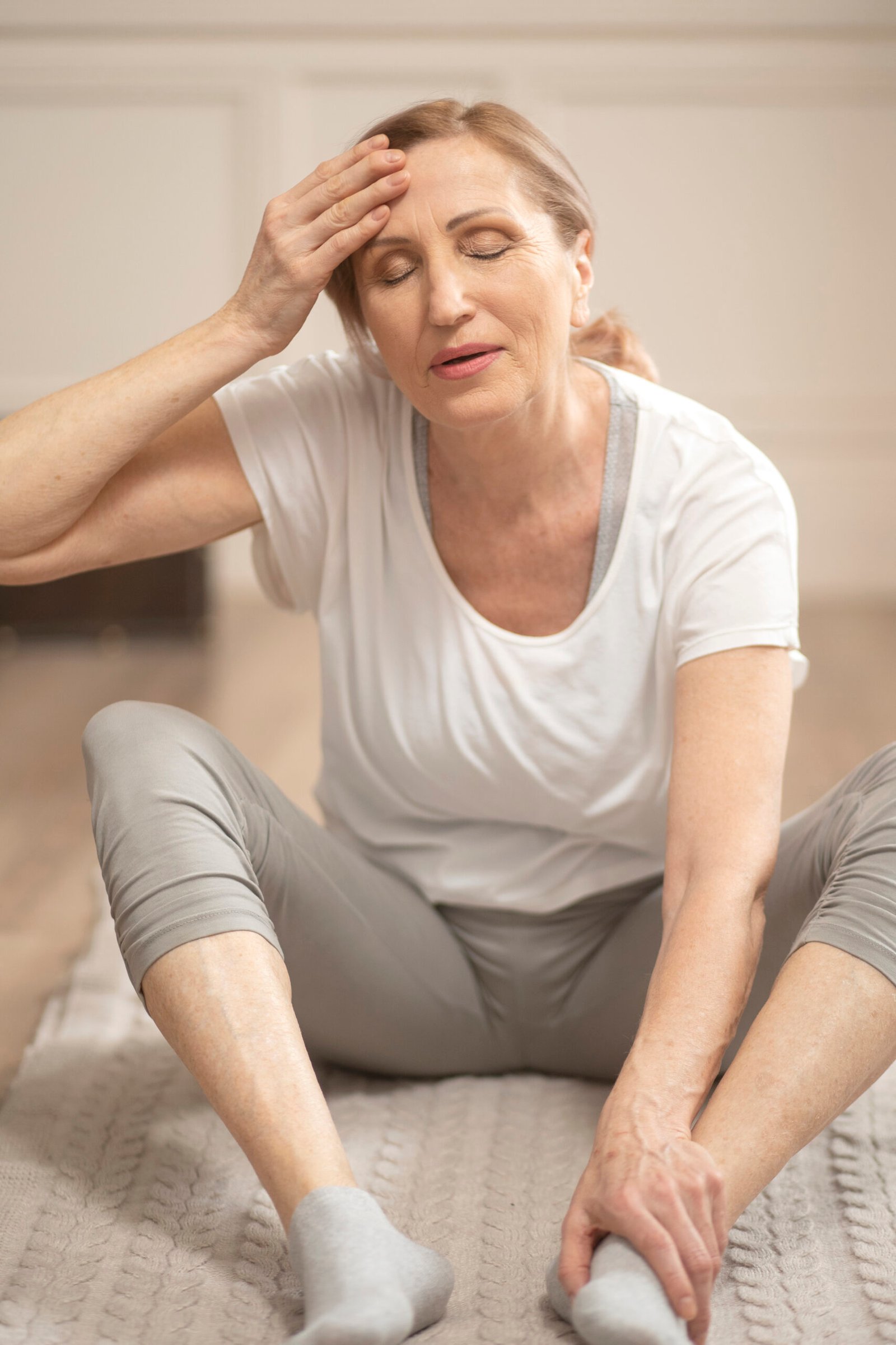 Cheerful Middle Aged Woman Relaxing After Making Yoga Exercises Scaled