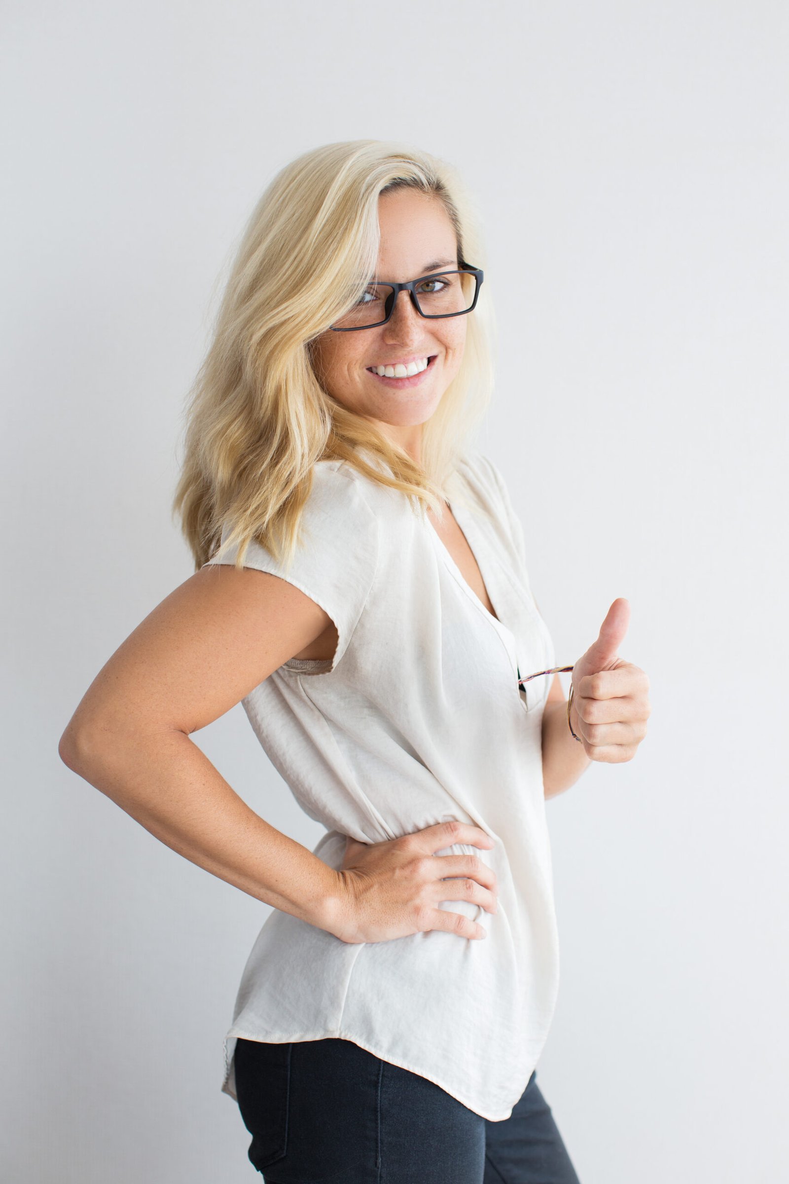 Successful Young Businesswoman Showing Thumb Up Scaled