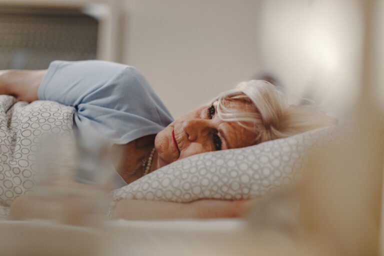 sleepless mature woman lying in the bed.
